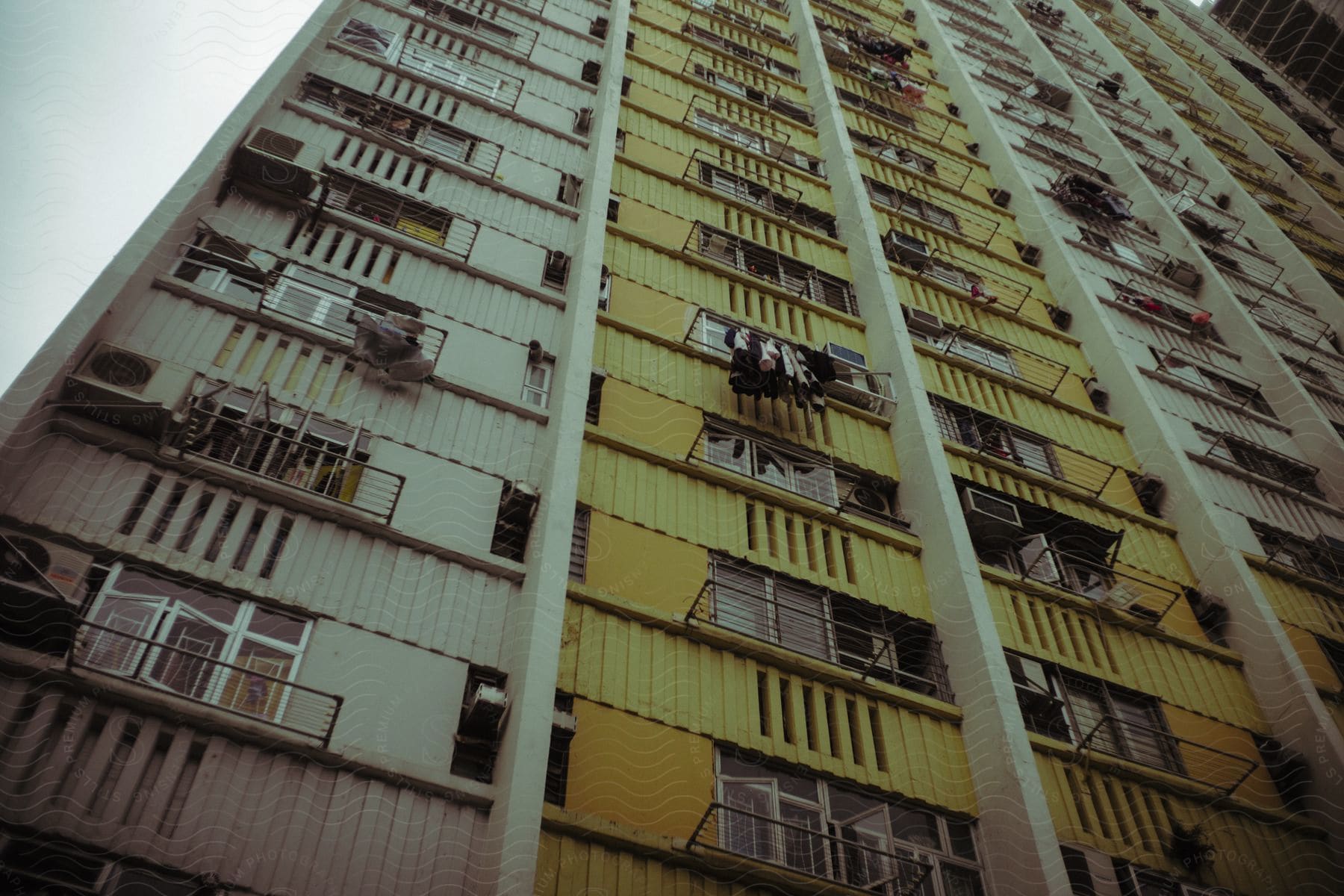 A tall apartment building outdoors in hong kong