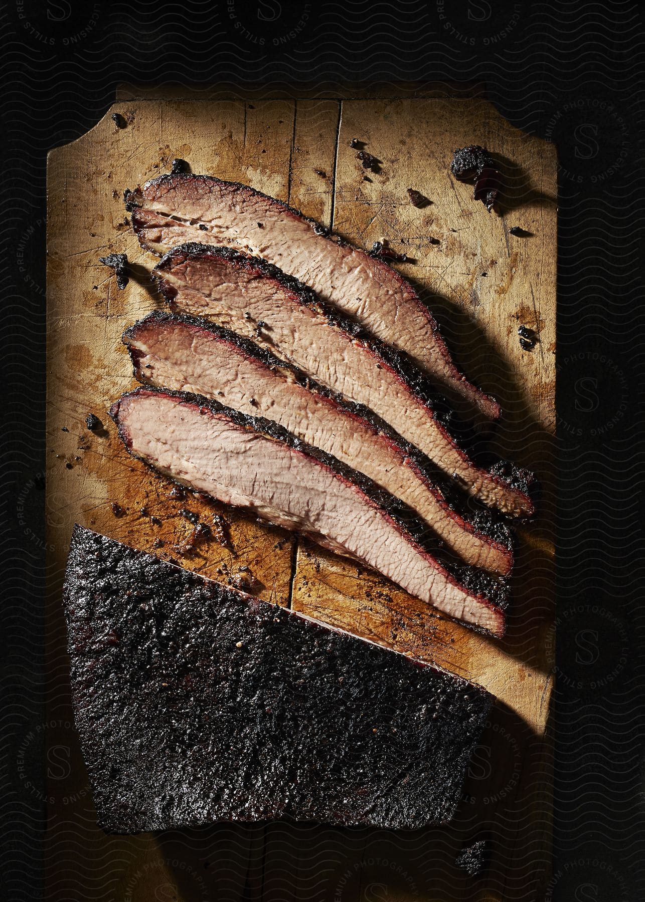 Stock photo of slow cooked brisket sliced on a cutting board