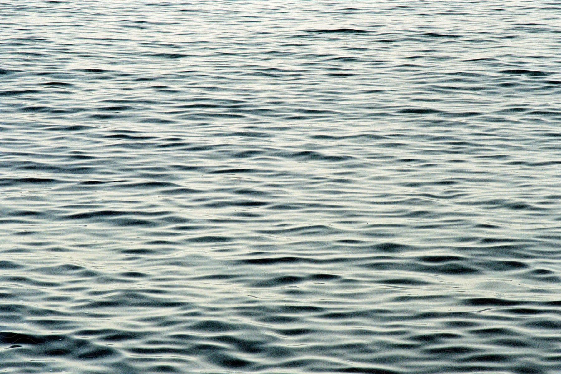 Blurry water ripples on a lake inaround islands on lake superior wisconsin