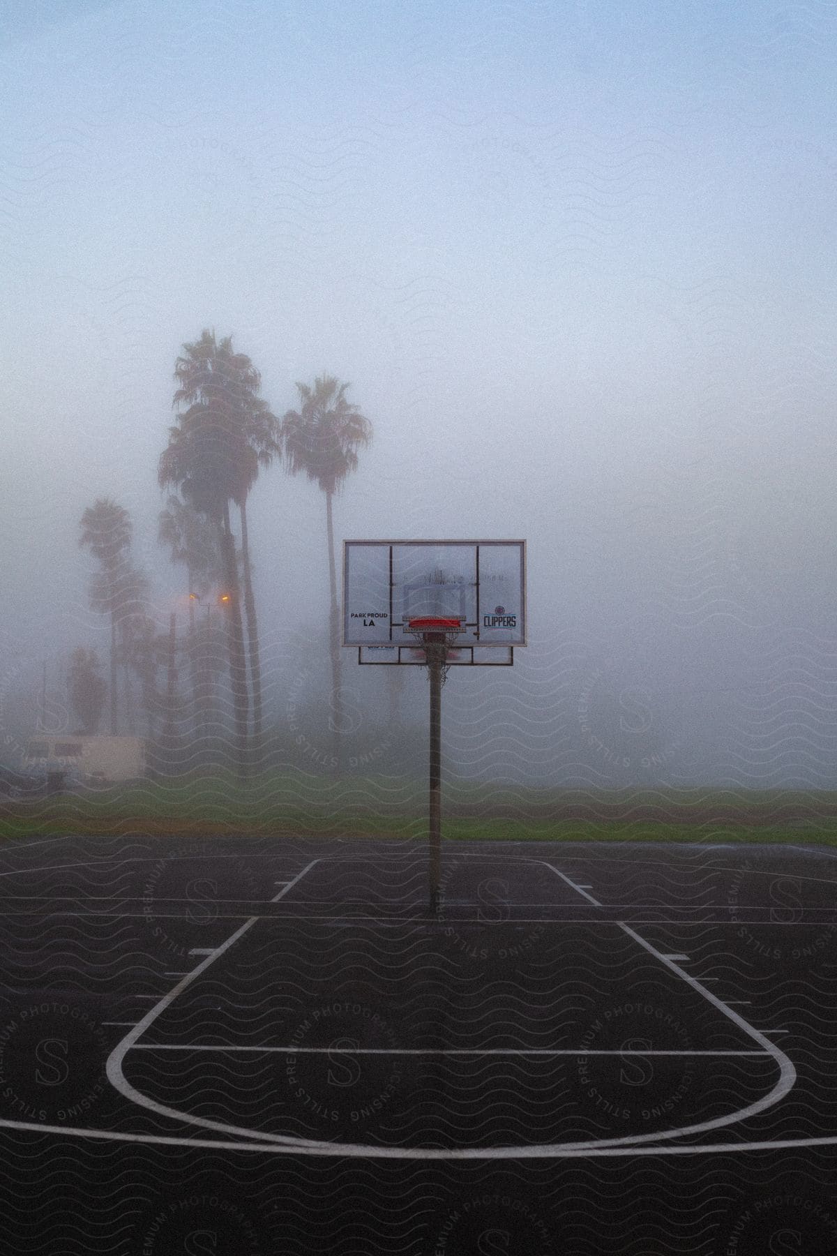 Fog Hovering Over Vacant Basketball Court At The Beach