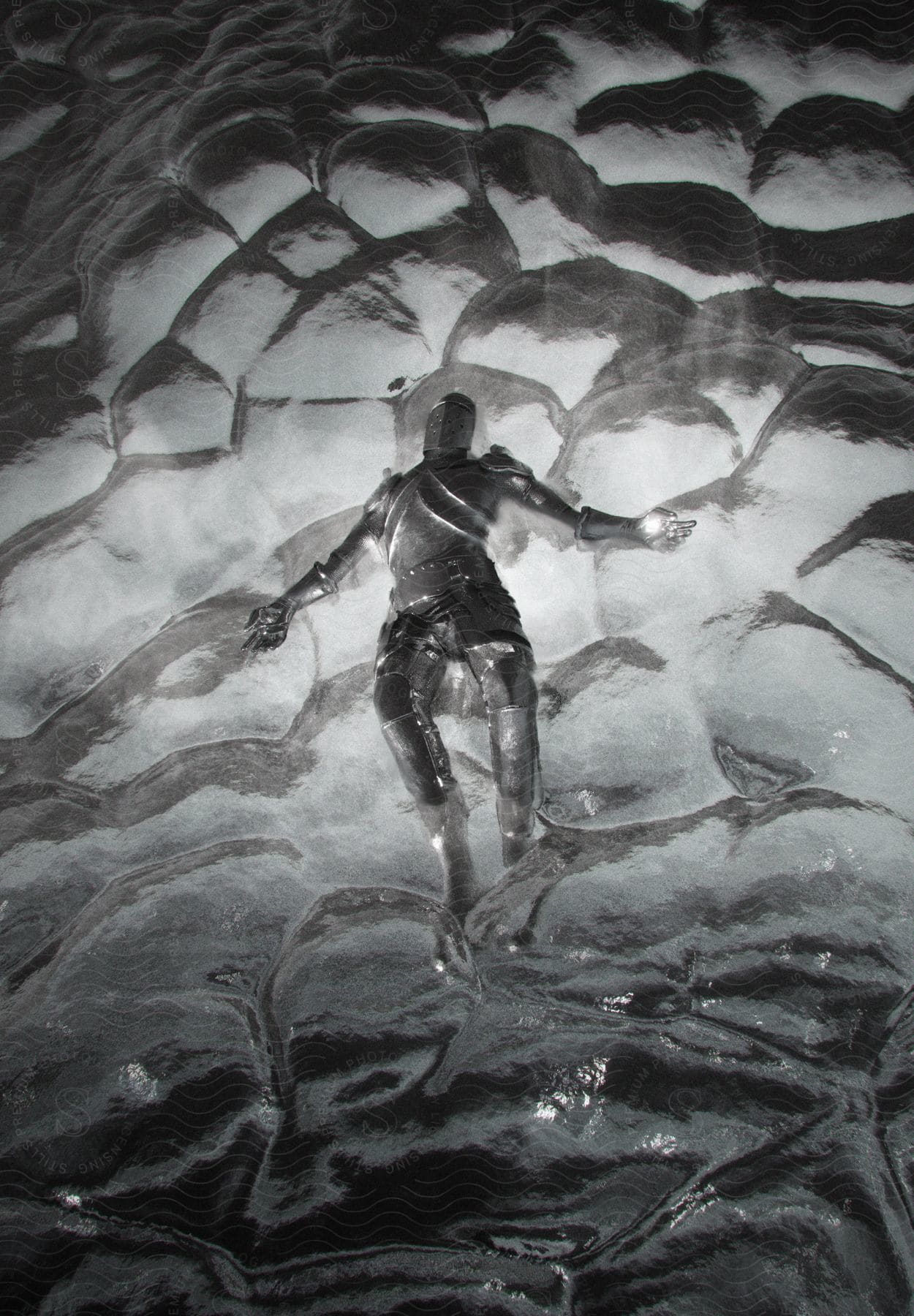 A metallic structure resembling a person in an ancient steel warrior suit floats on a bubble