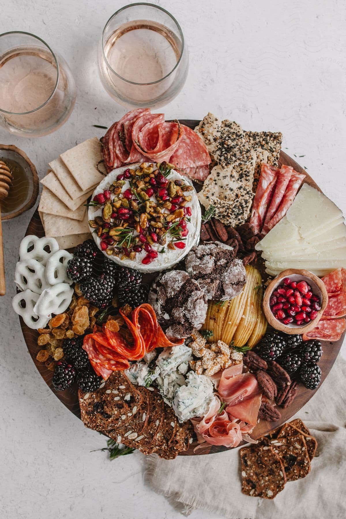 A charcuterie board filled with a variety of sweet and savory ingredients