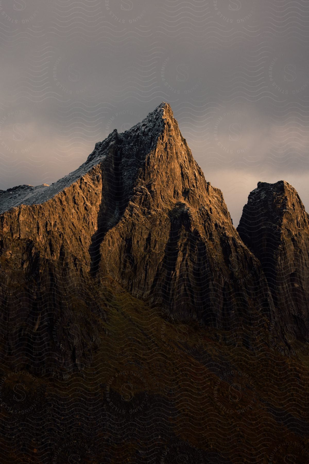 Snowdusted mountains illuminated by the morning sun