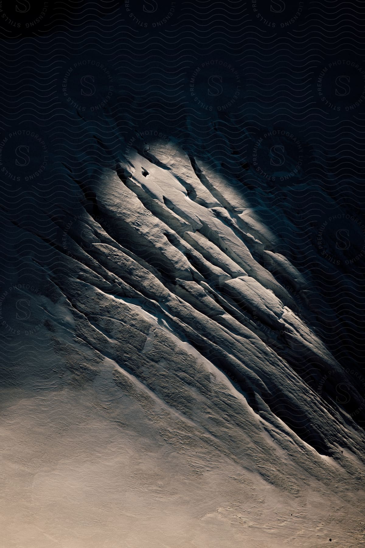 A cracked mountain of ice in a snowy landscape