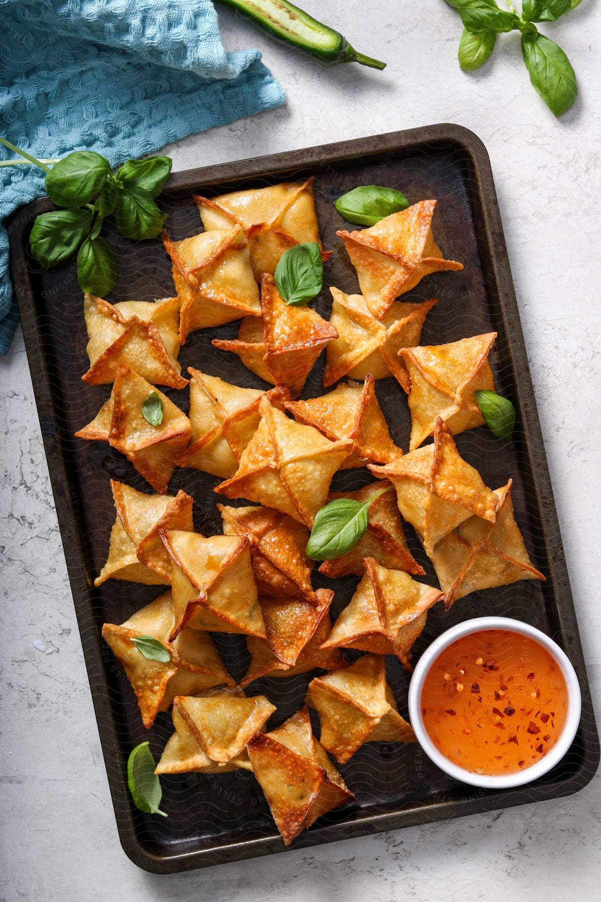 Close up of crab rangoons on tray