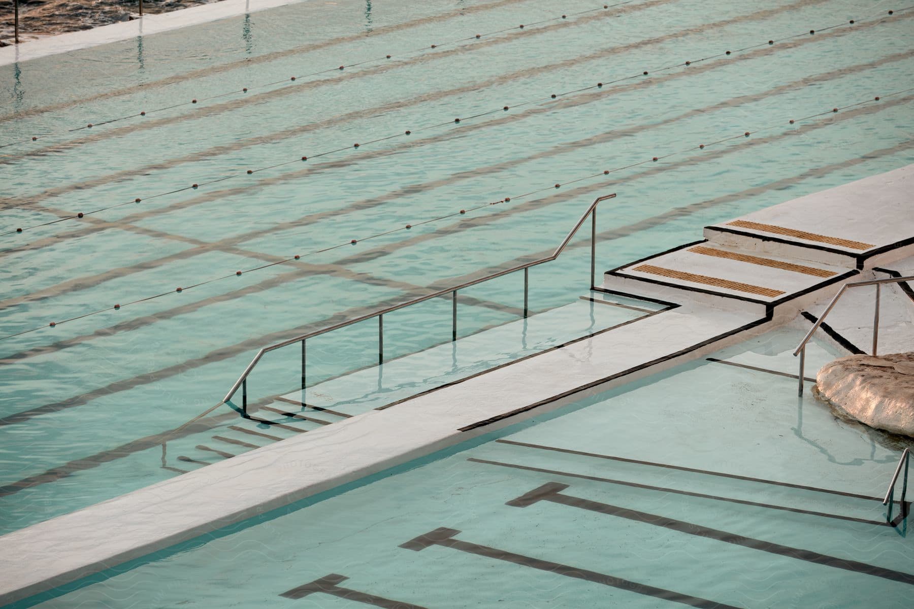 Iconic Bondi Icebergs Pool Located Outdoors During The Day Featuring A Rectangular Swimming Pool Surrounded By A Neutralcolored Floor