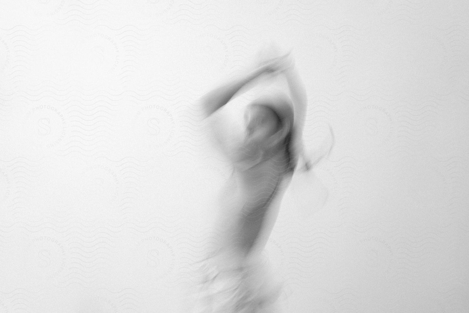 Stock photo of a woman dancing in a blurry image