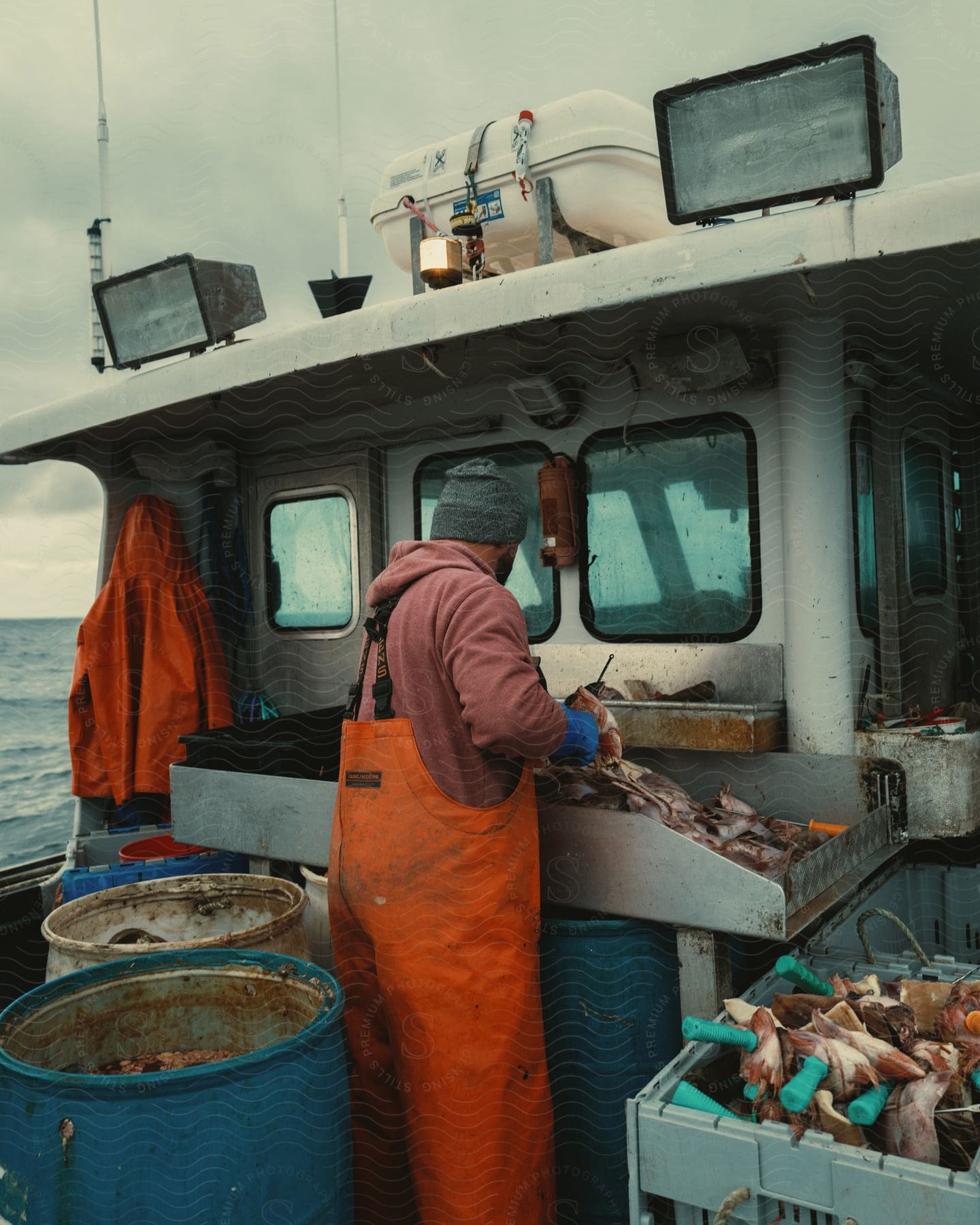 A man fishing on a boat outdoors