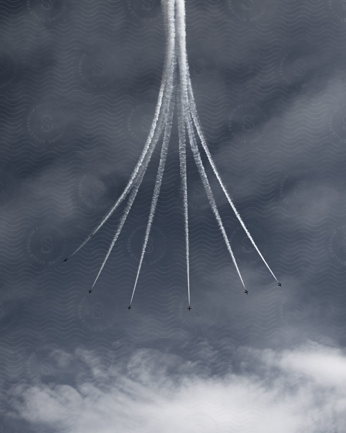 Acrobatic Airplanes Create Trails In The Sky During The Day