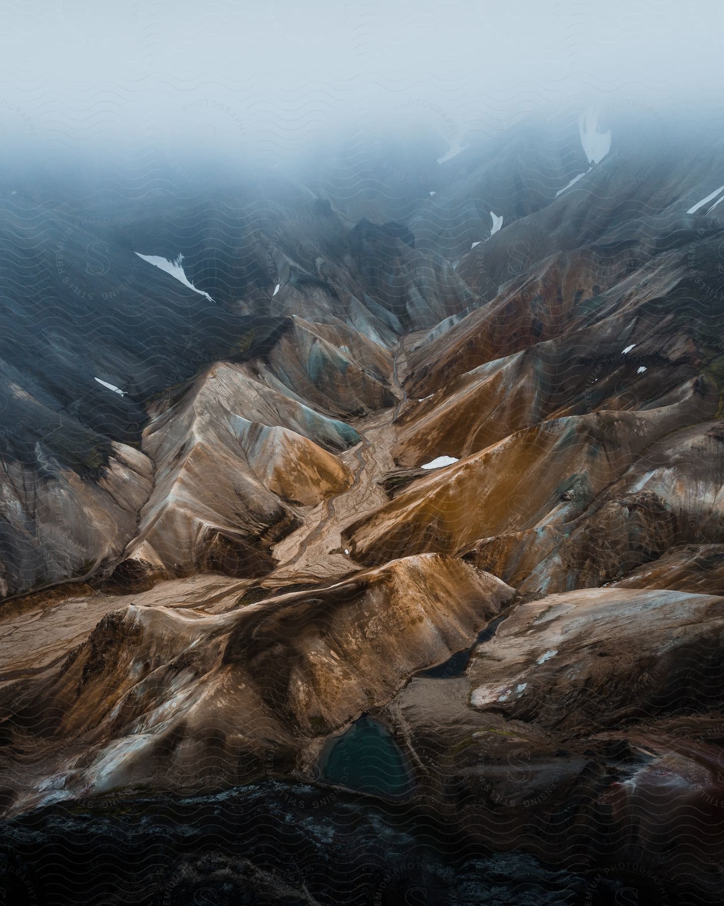 Aerial view of a mountain canyon and rocky cliffs.