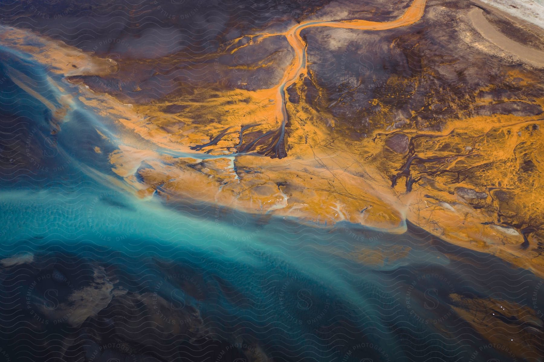 Aerial shot of flowing icelandic glacial rivers