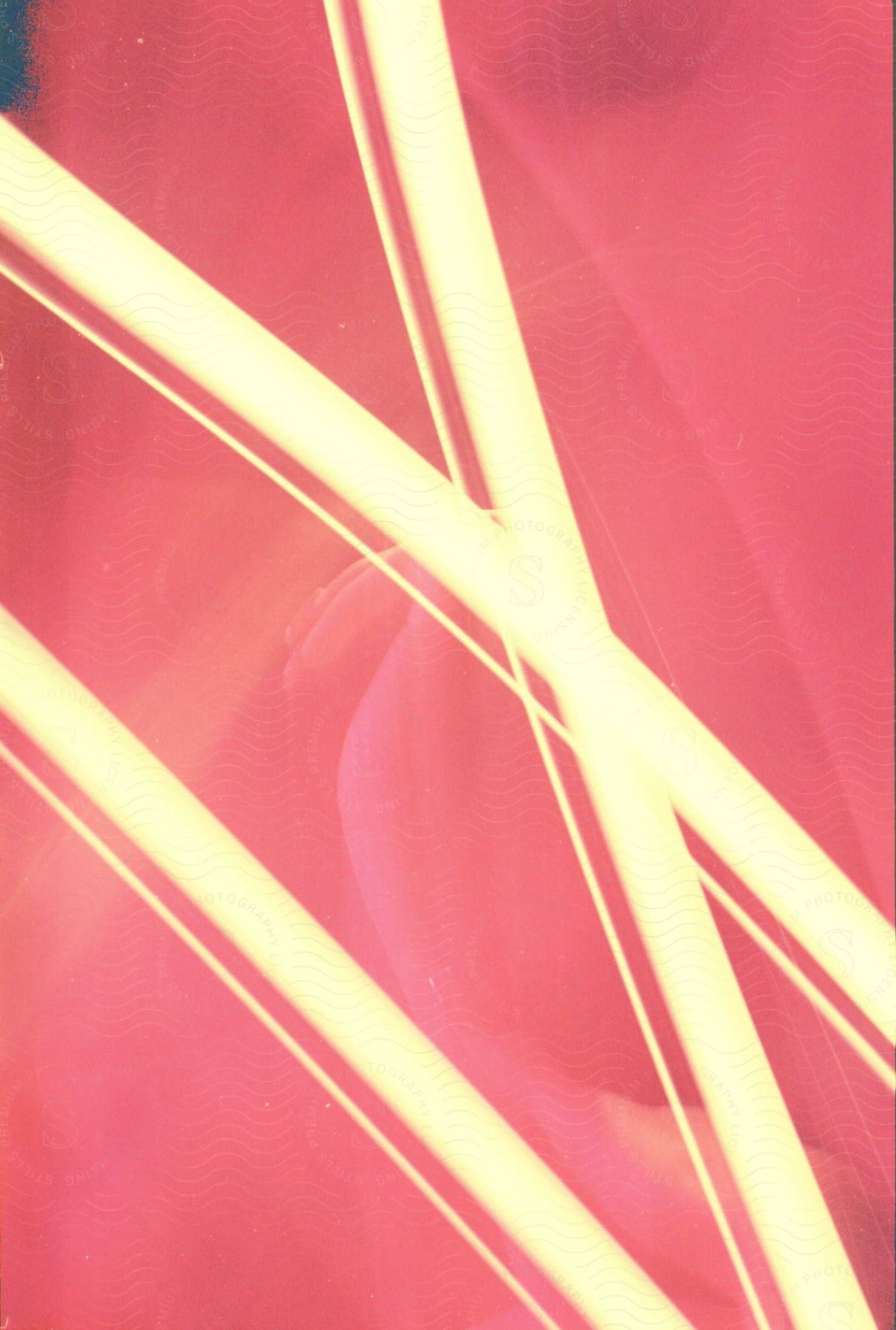 Close up of yellow stripes over a red background