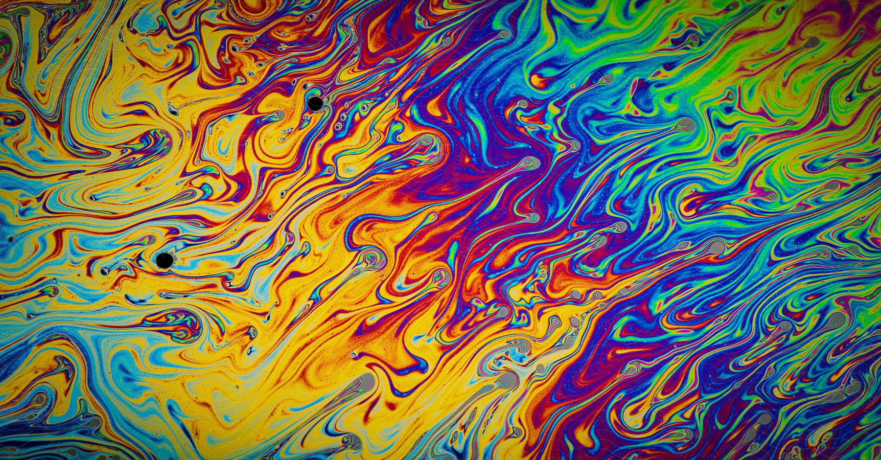 Stock photo of layers of paint swirl throughout mixture.