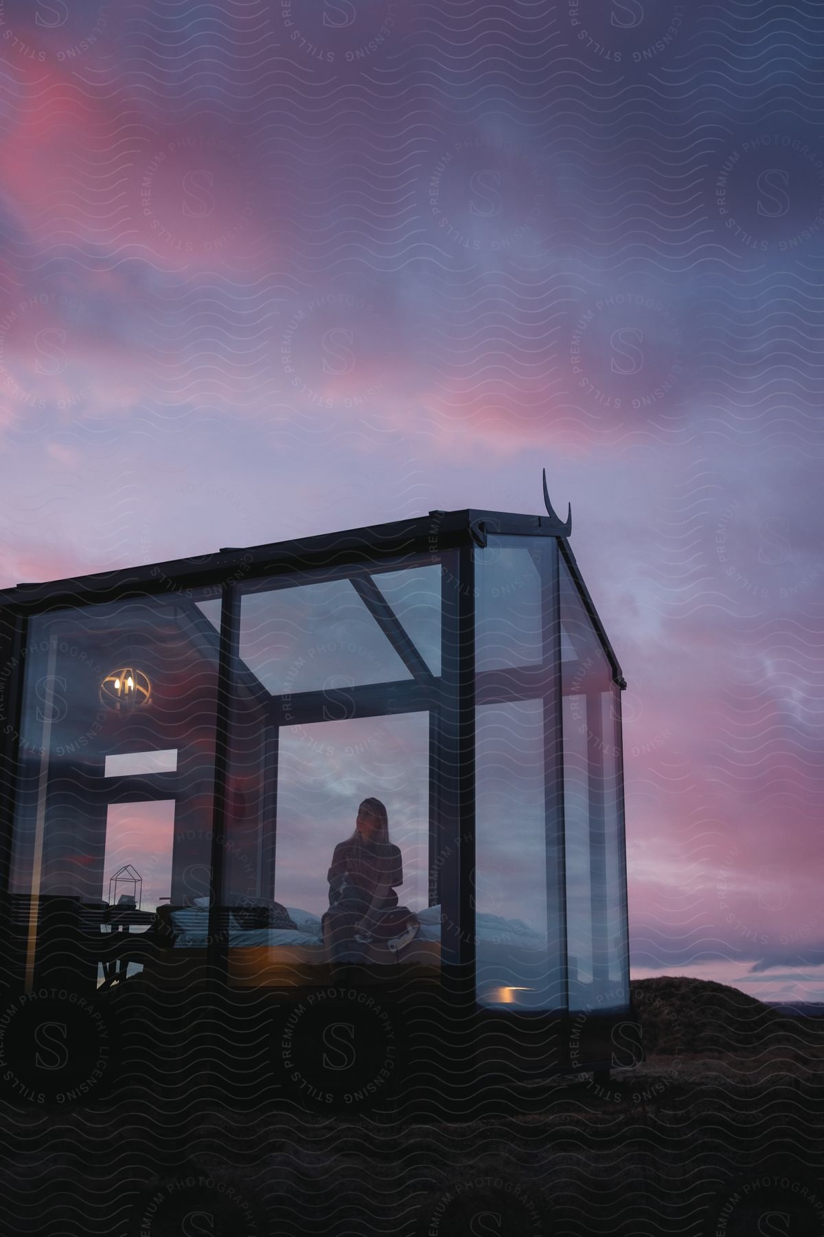 Stock photo of a woman in a welllit room creating a warm and inviting atmosphere