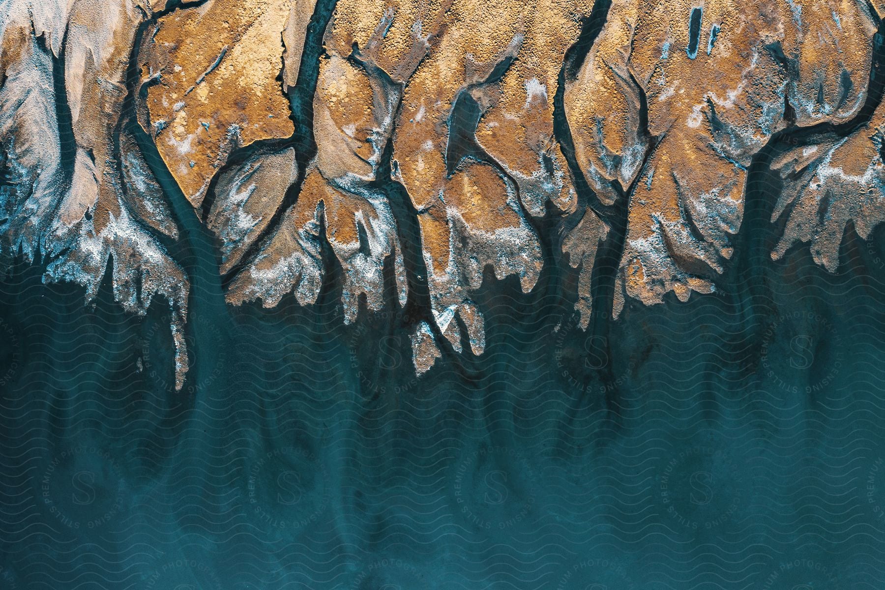 Coastline and ocean water seen from above