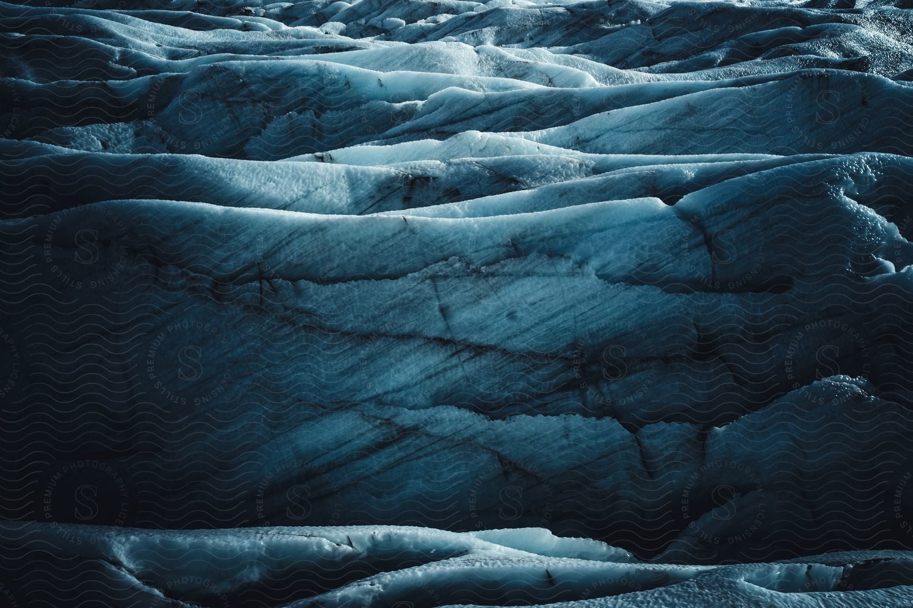 Ice caps covering the land with striations throughout the ice