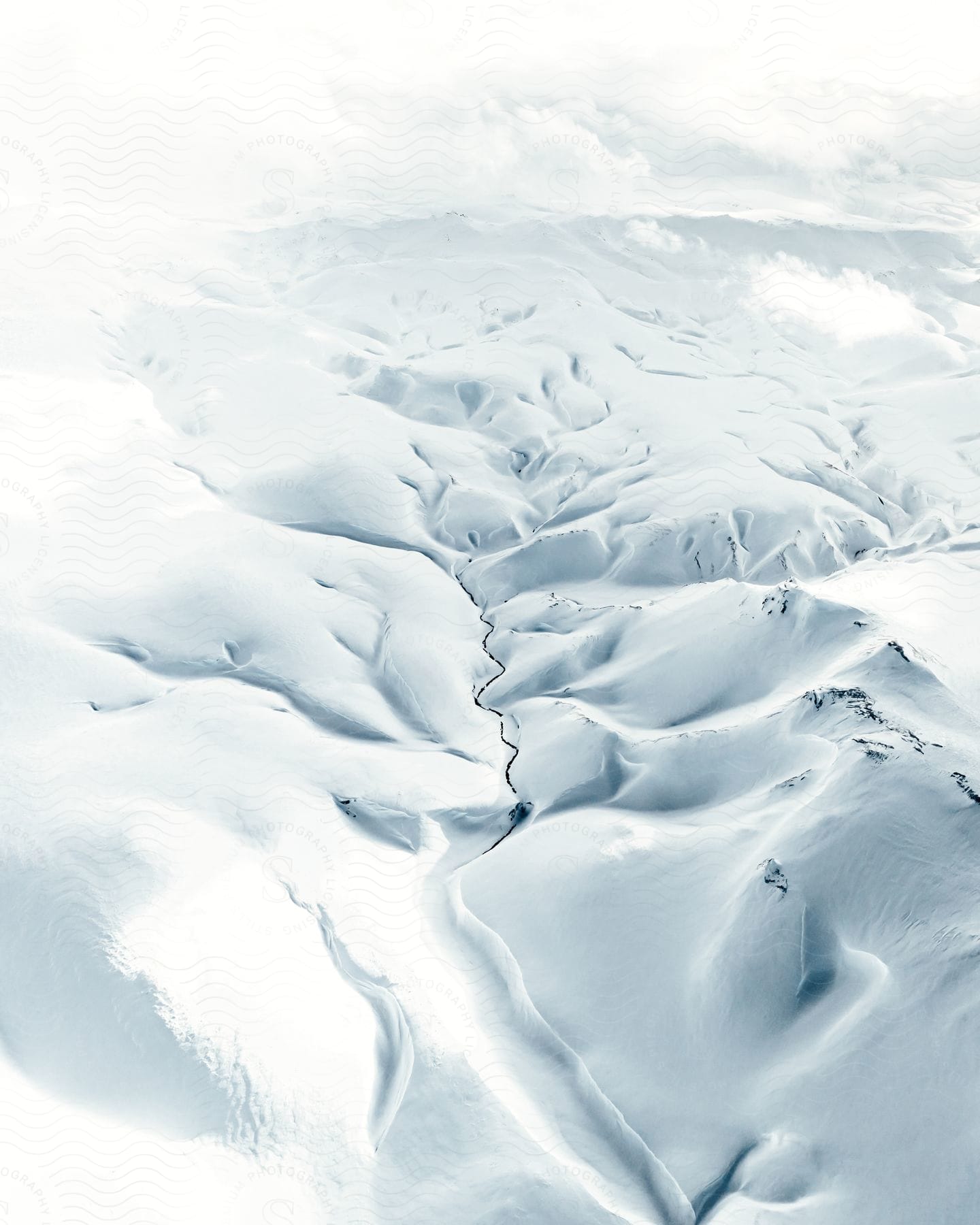 A Snowy Mountain Slope In Iceland