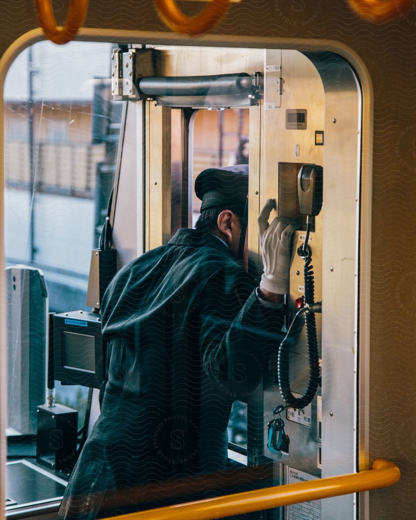 A train conductor looking out the window