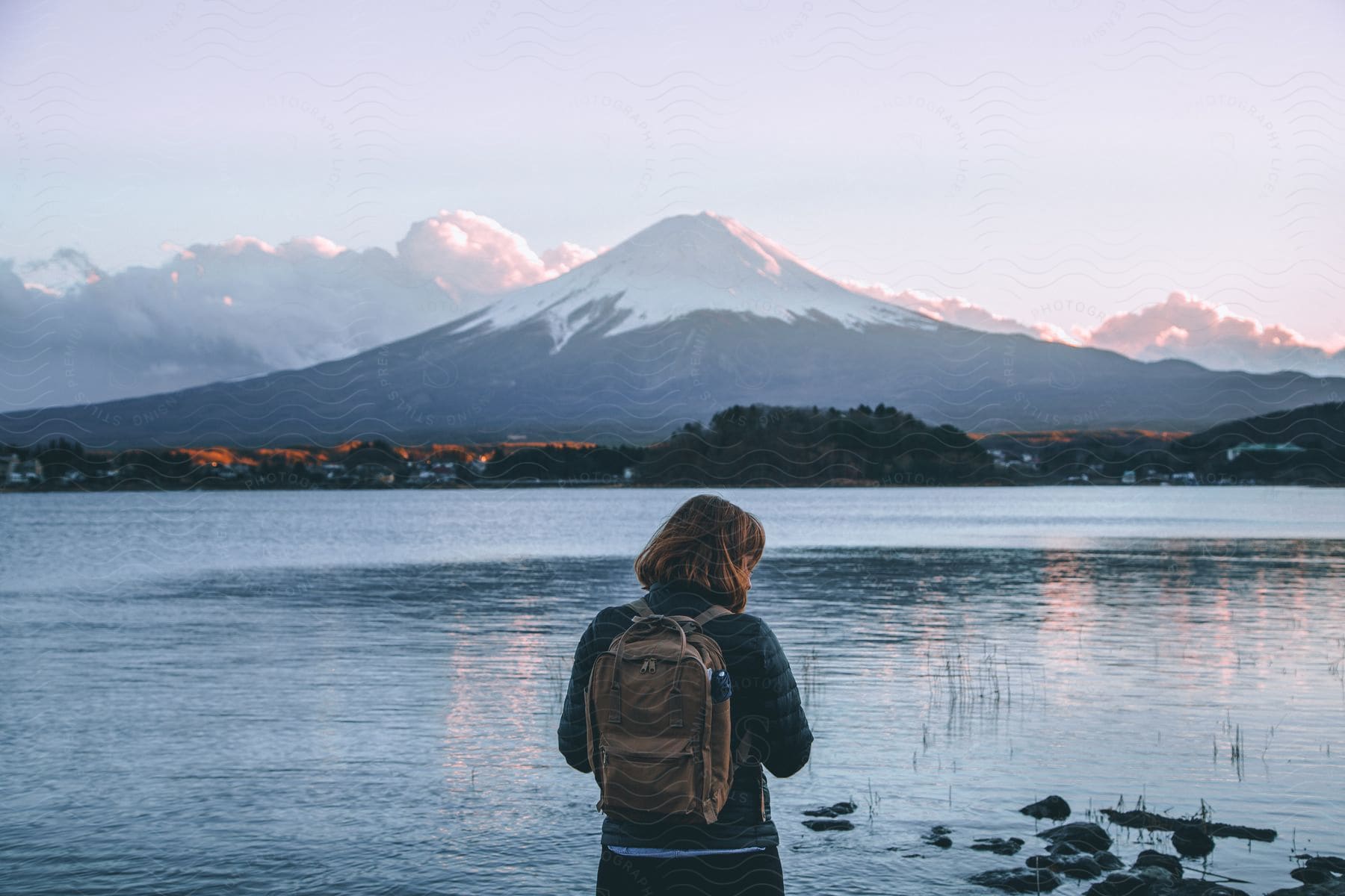 A woman hiking outdoors during sunset