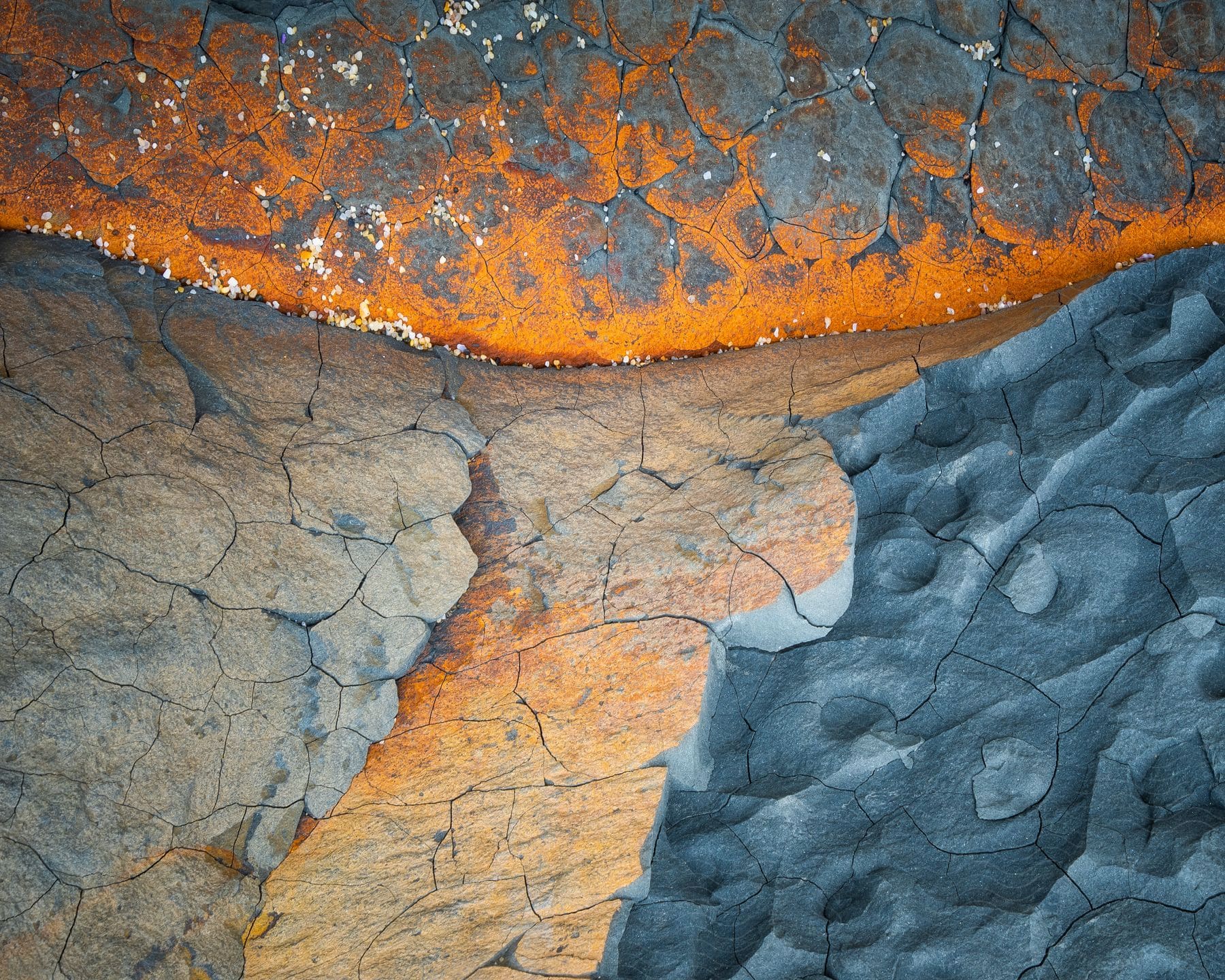 Abstract impact of a volcanic eruption on a rock displaying fiery chaos and raw power