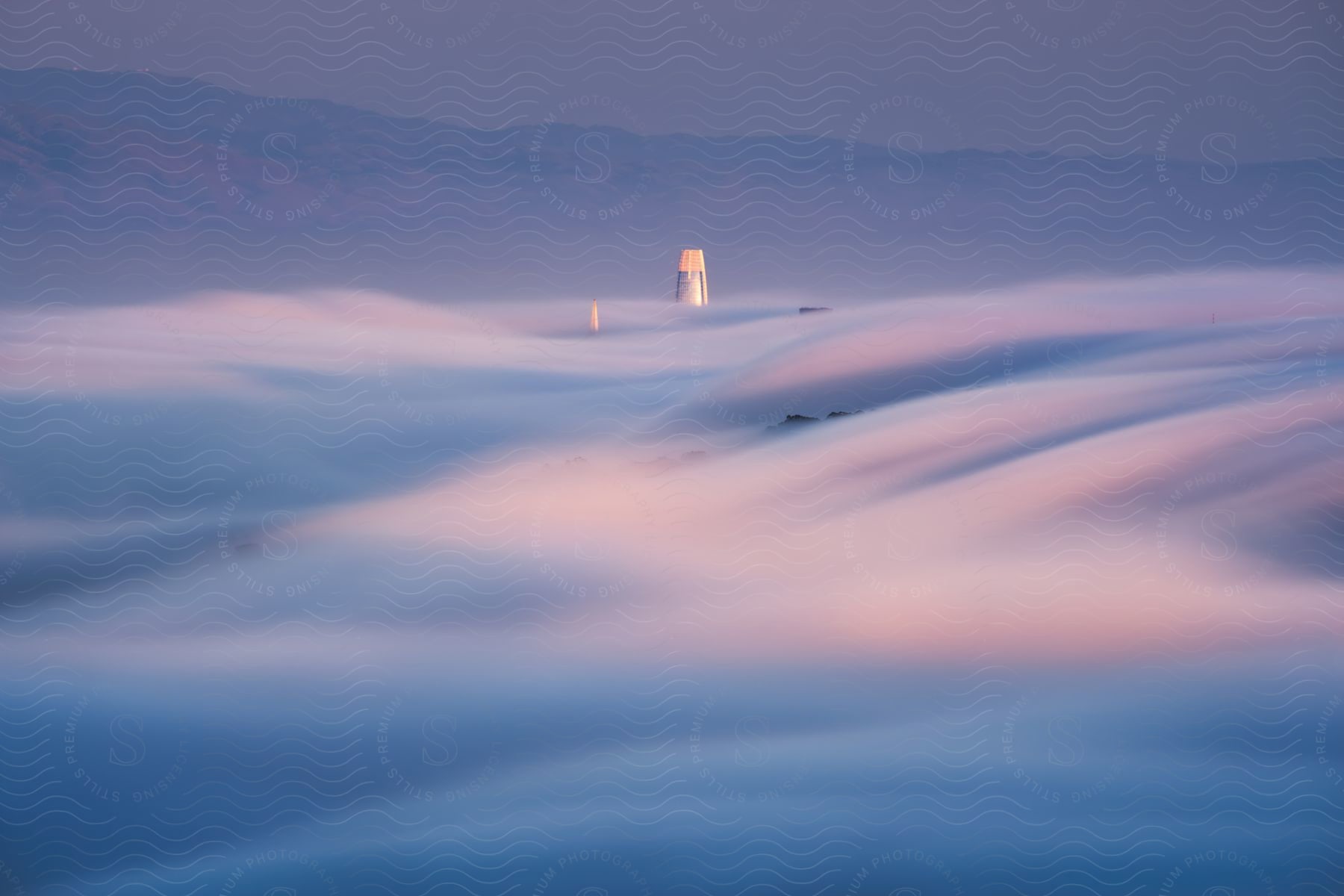 A skyscraper pierces through vibrant swirling clouds