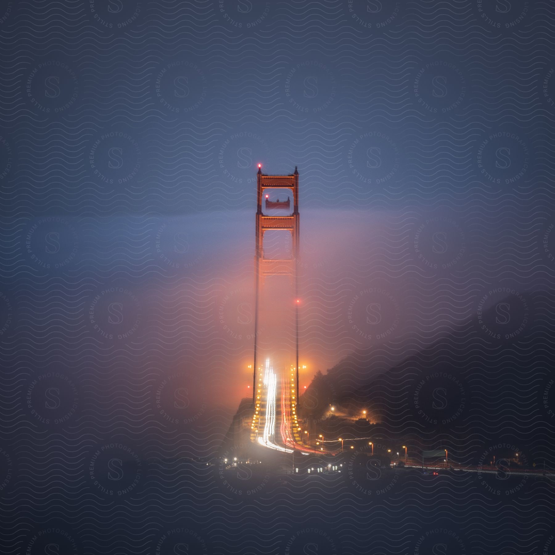 A night view of a community with a bridge and street light