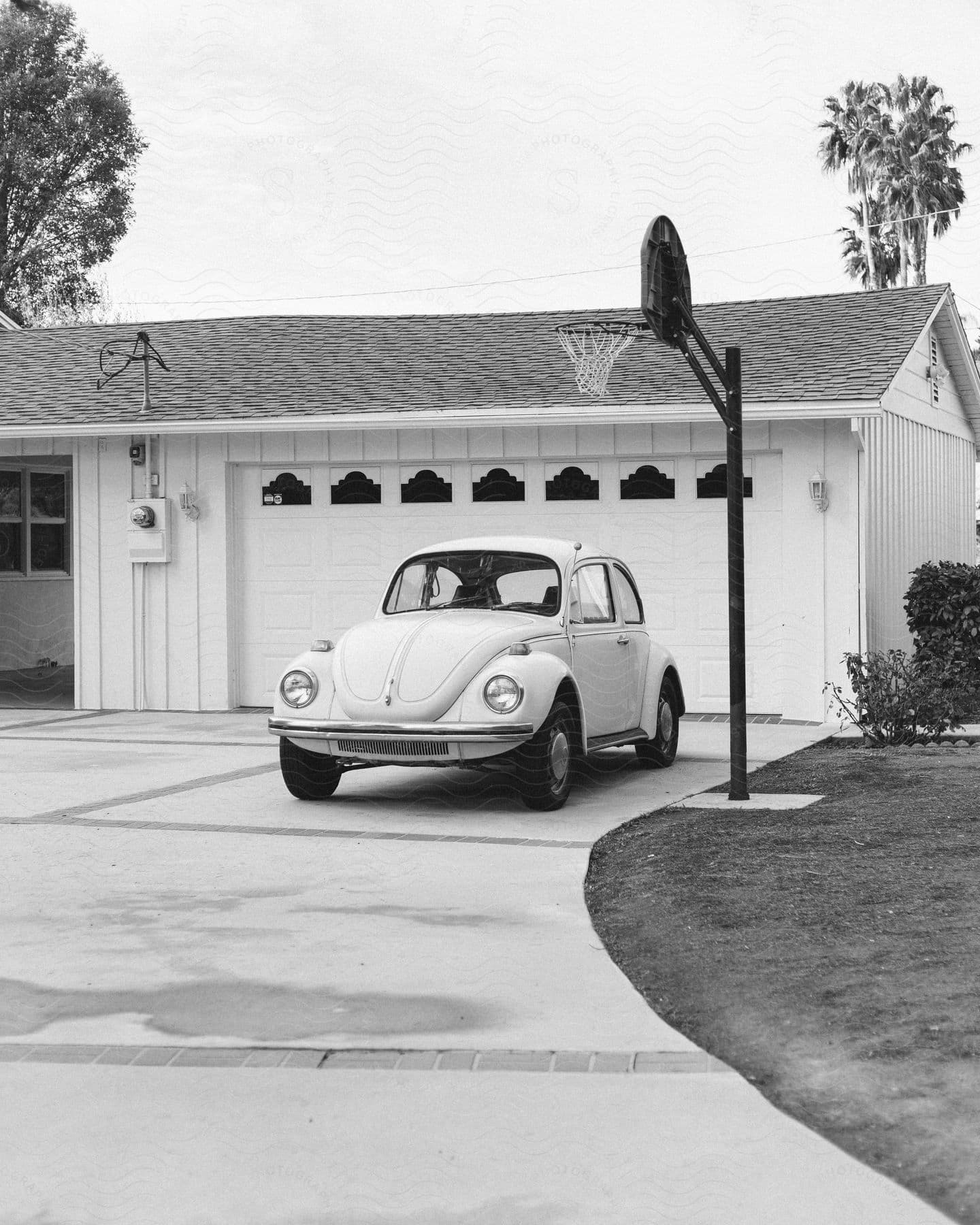 Small car parked in front of an urban house