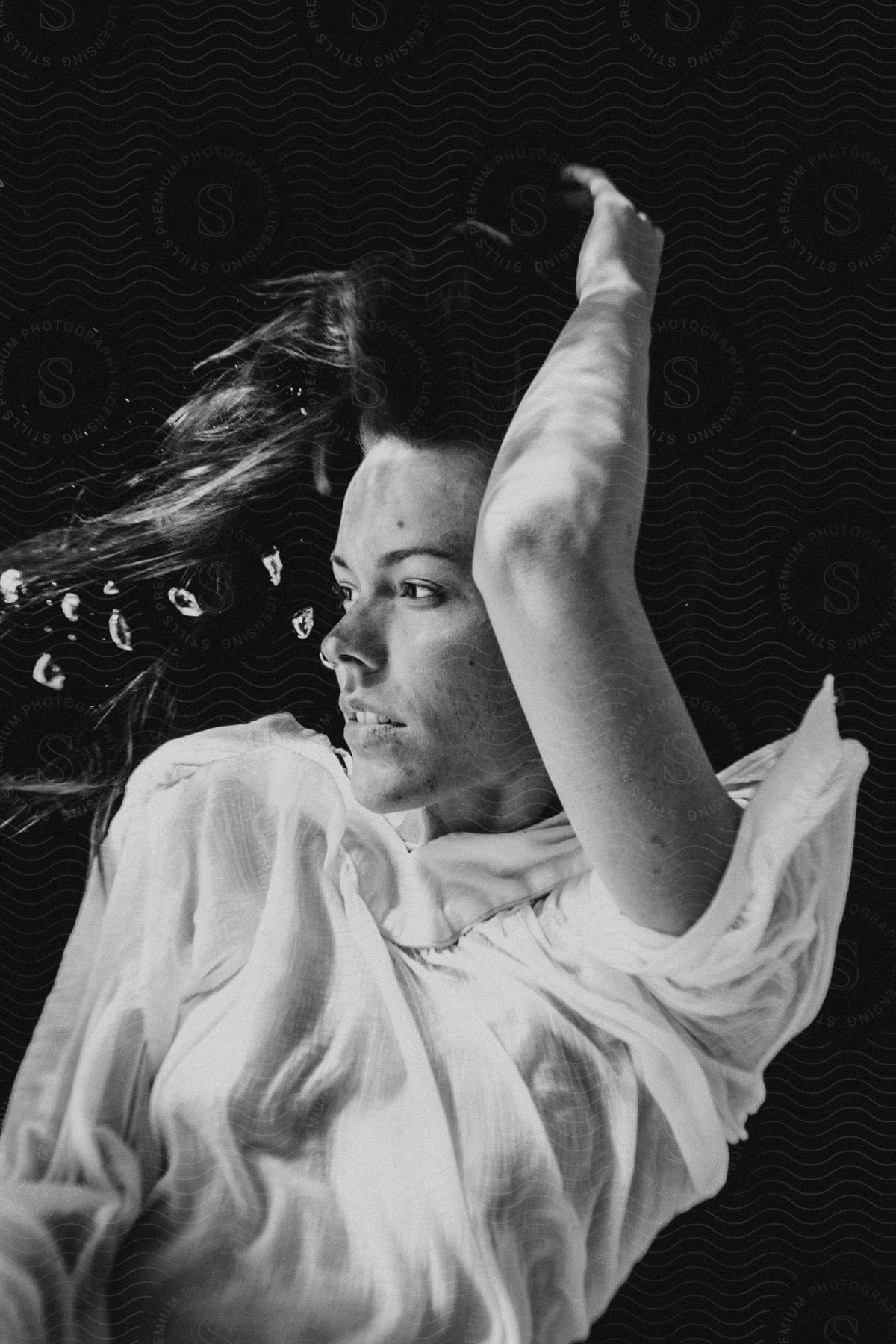 A woman relaxes underwater