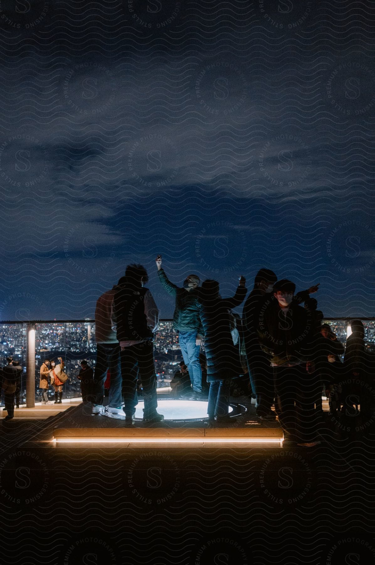 A small group of people having fun in tokyo at night