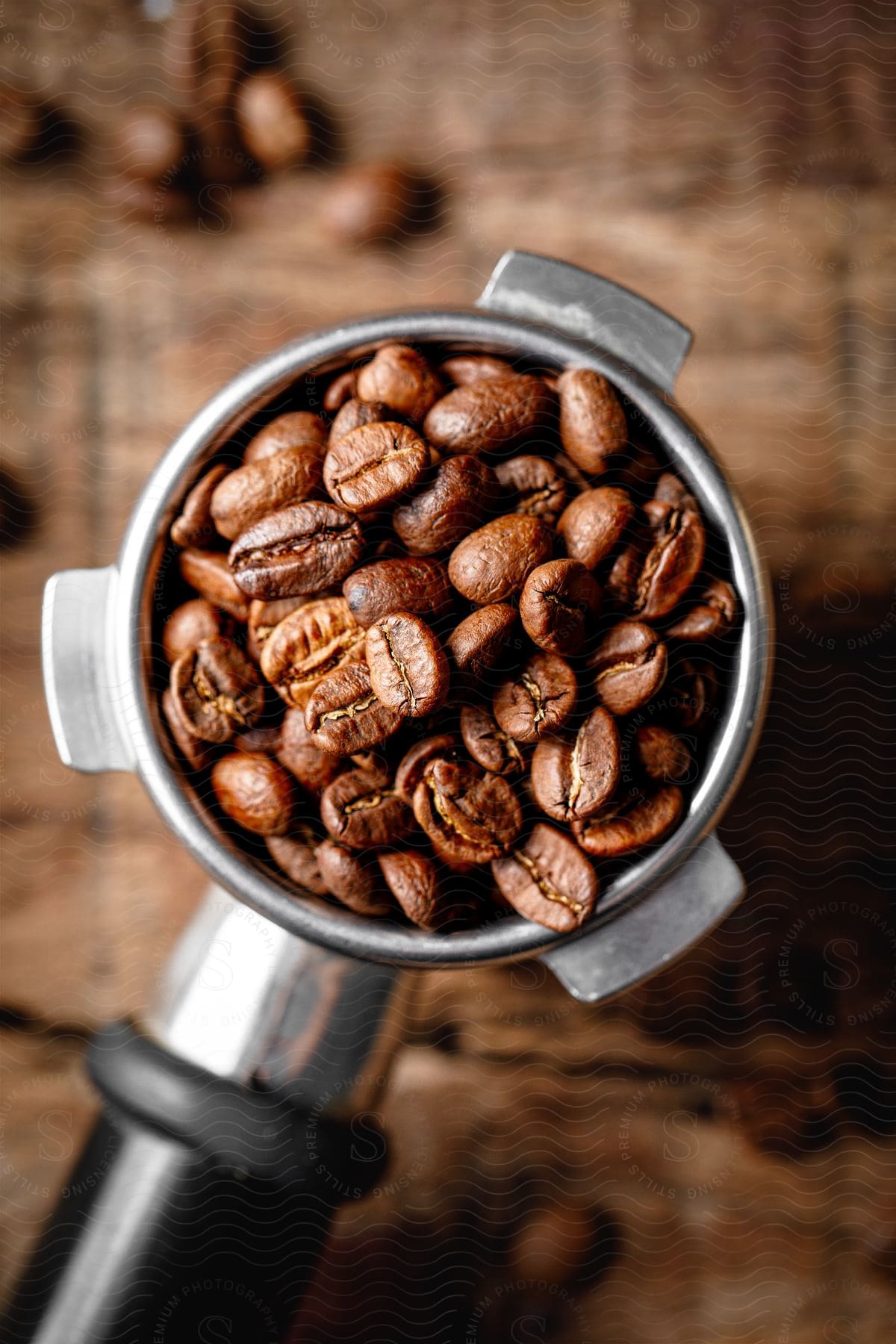 Coffee beans are in a measuring cup