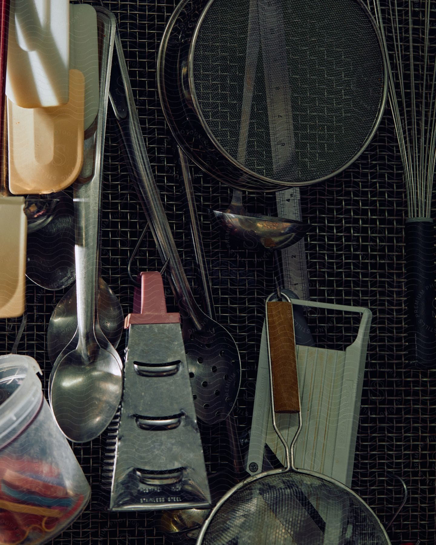 Kitchen utensils hanging from a wall