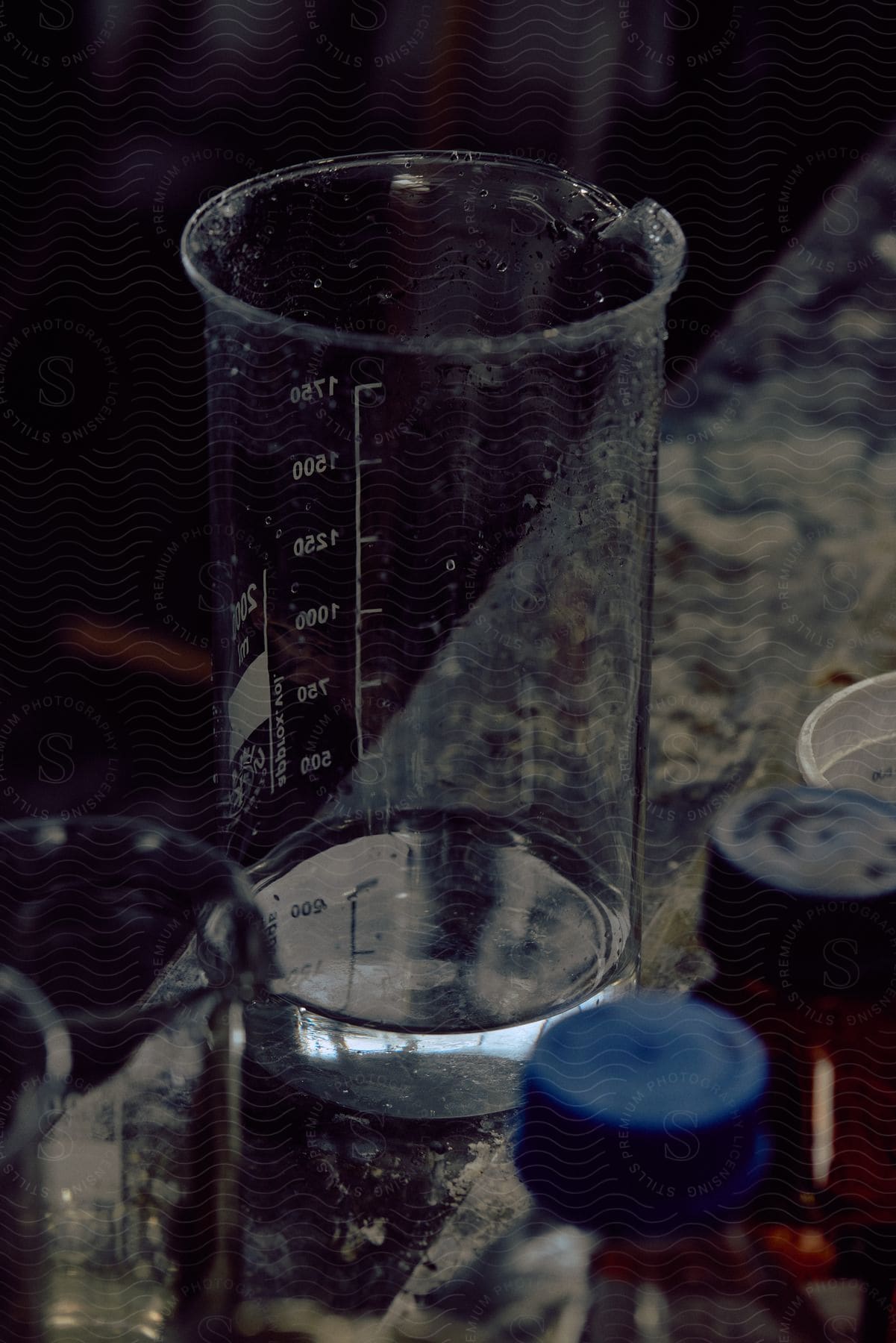 A cup and a measuring cup on a table