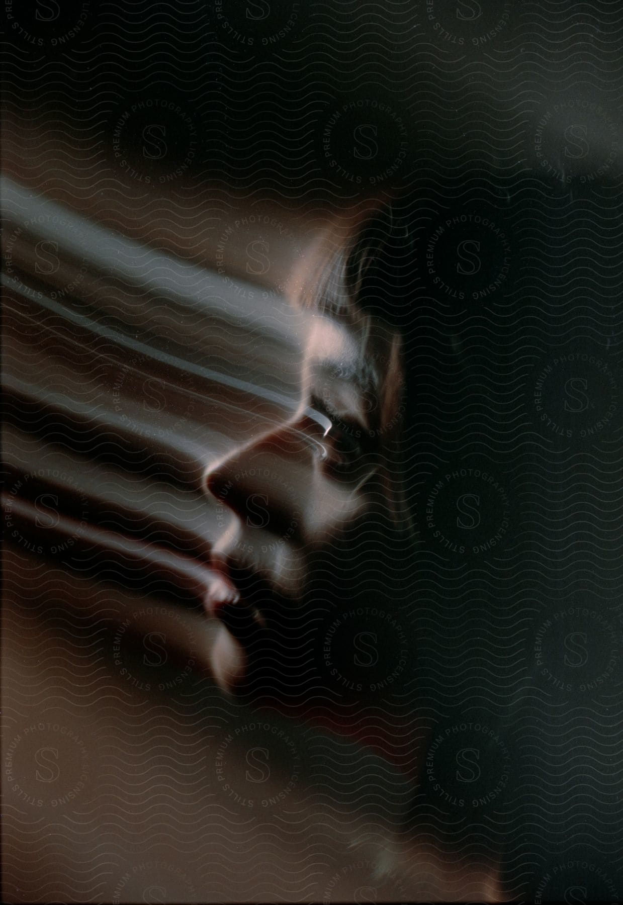 Profile of a female face distorted by motion blur