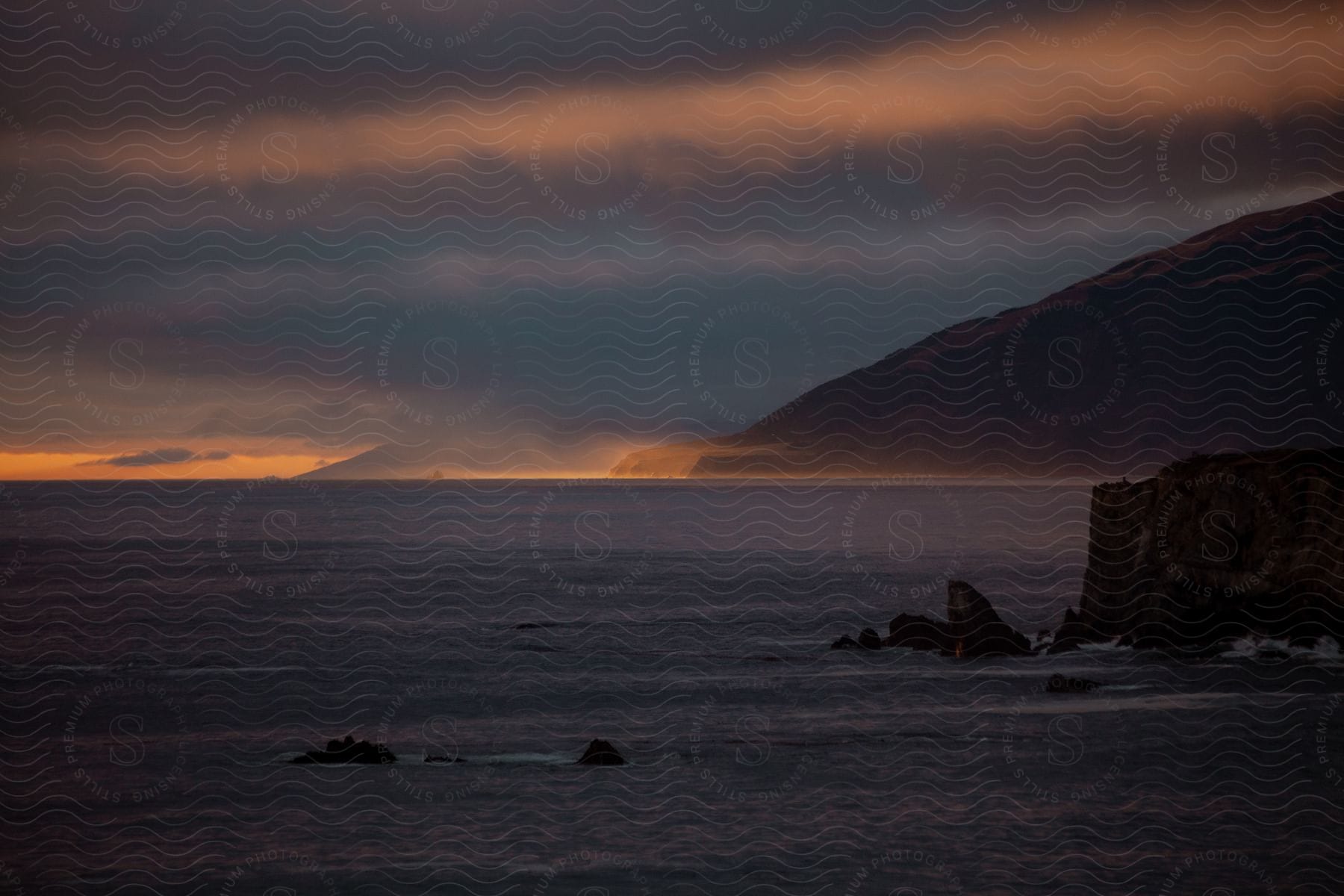 Bay landscape with majestic cliff and vast ocean expanse