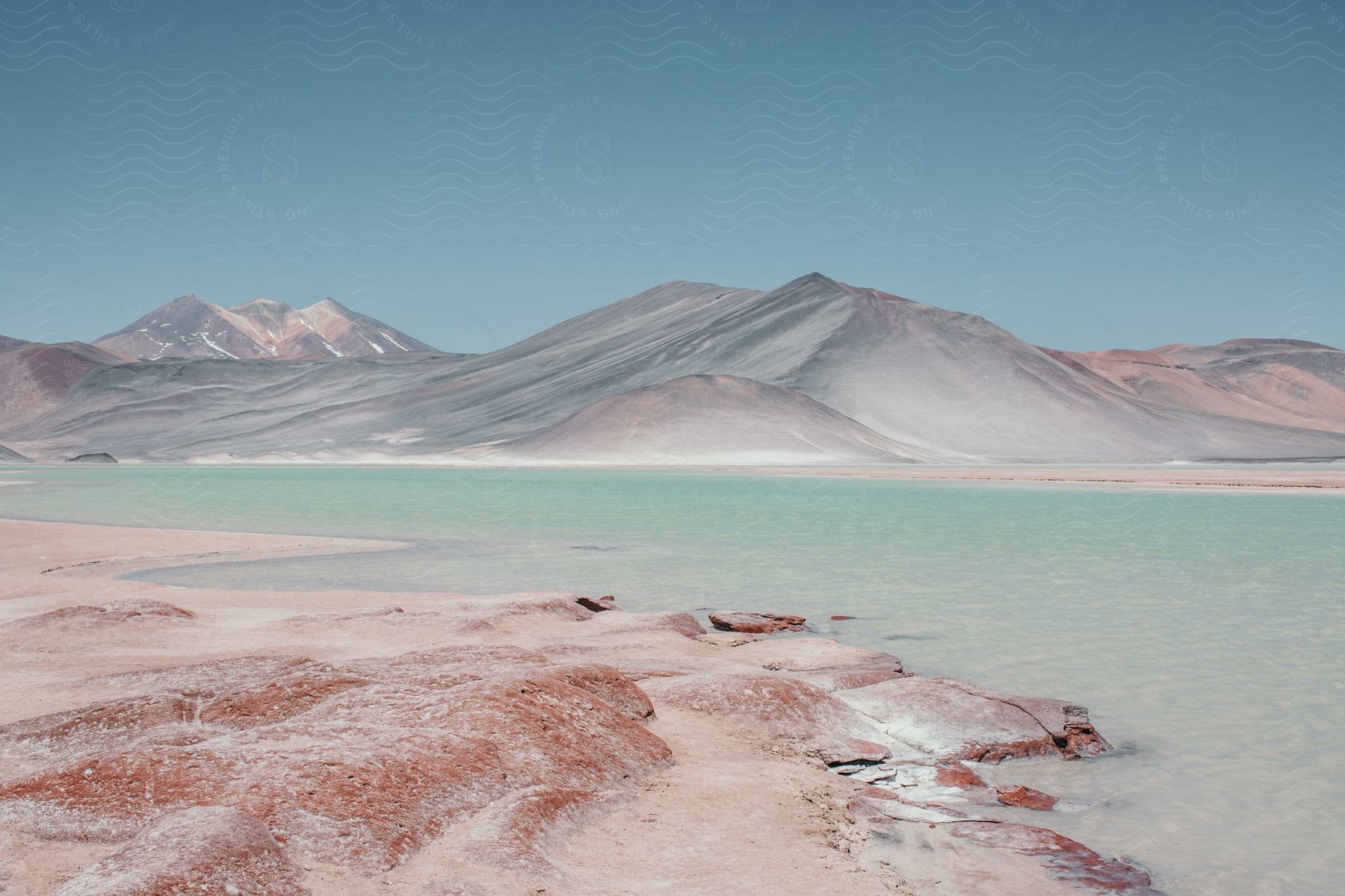 A salt lake in front of a mountain range