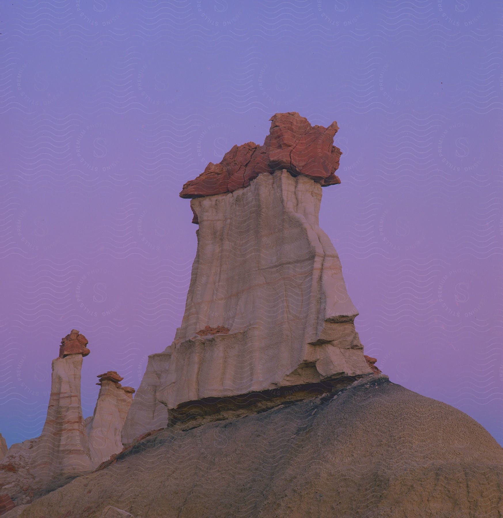 A tall rock formation in the desert