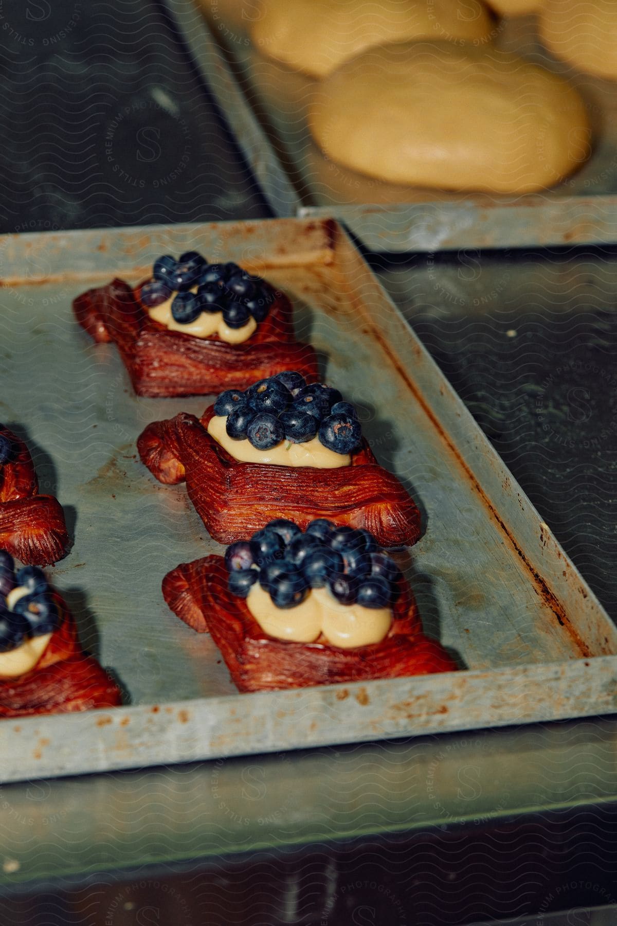 A table with baked goods bread and blueberries