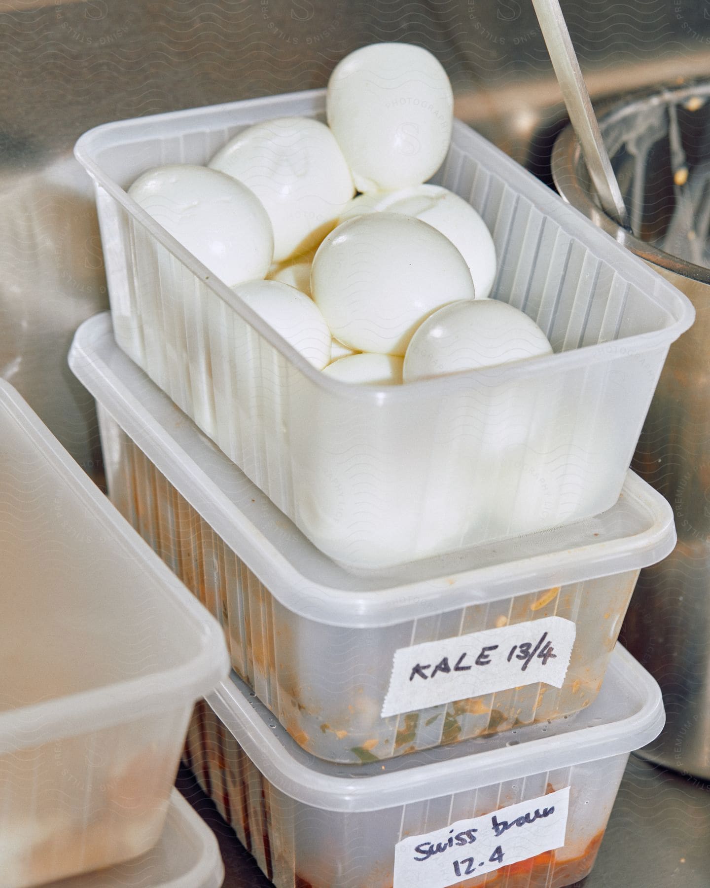 Eggs on a plastic tray over a metal kitchen table