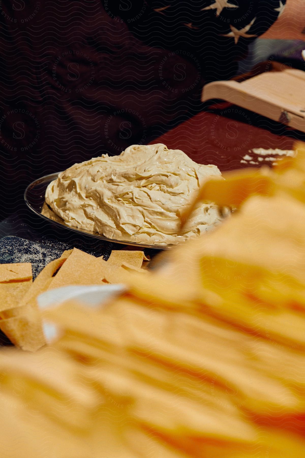 A table in a room a plate holds a smooth and creamy butter paste adding visual appeal to the scene