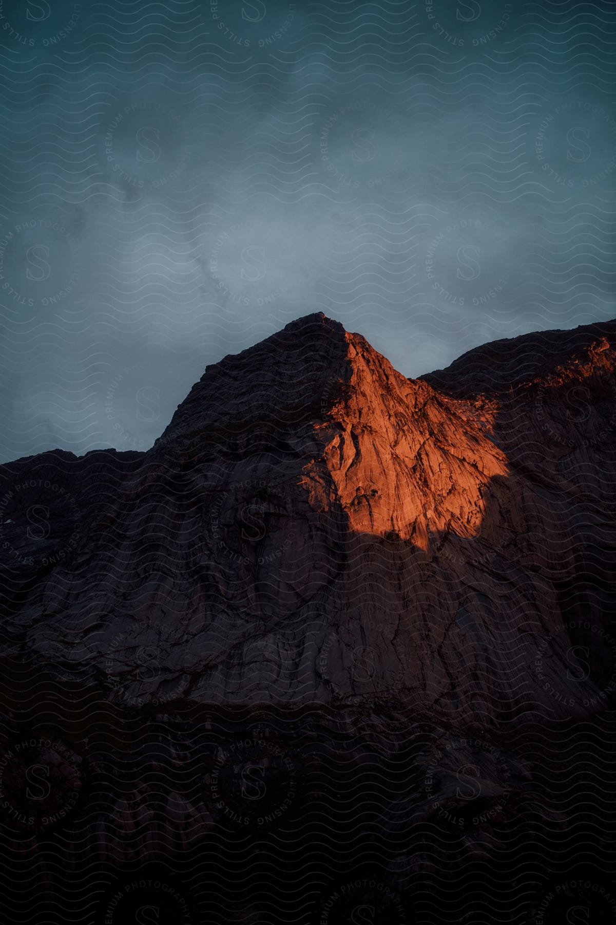 Red Rock Mountains Under A Cloudy Sky