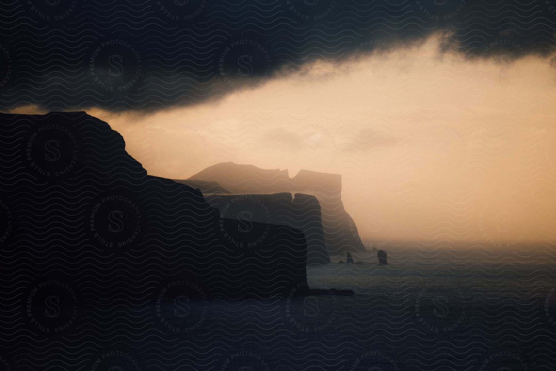 A scenic view of the faroe islands wild coast with mountains water and cliffs