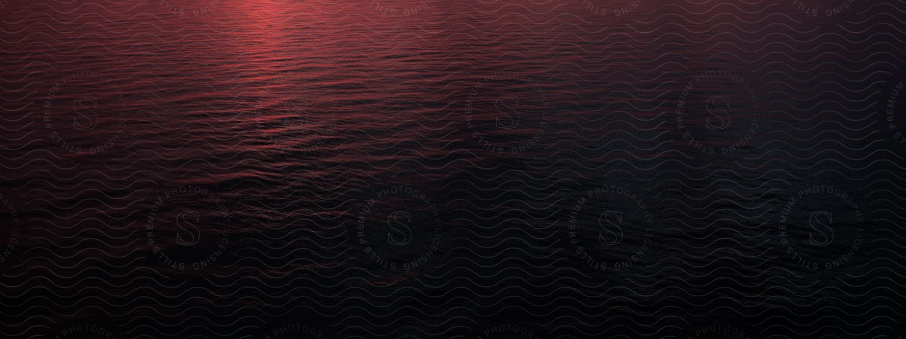 Sea With Red Reflections At Dusk Or Dawn In An Exterior Location