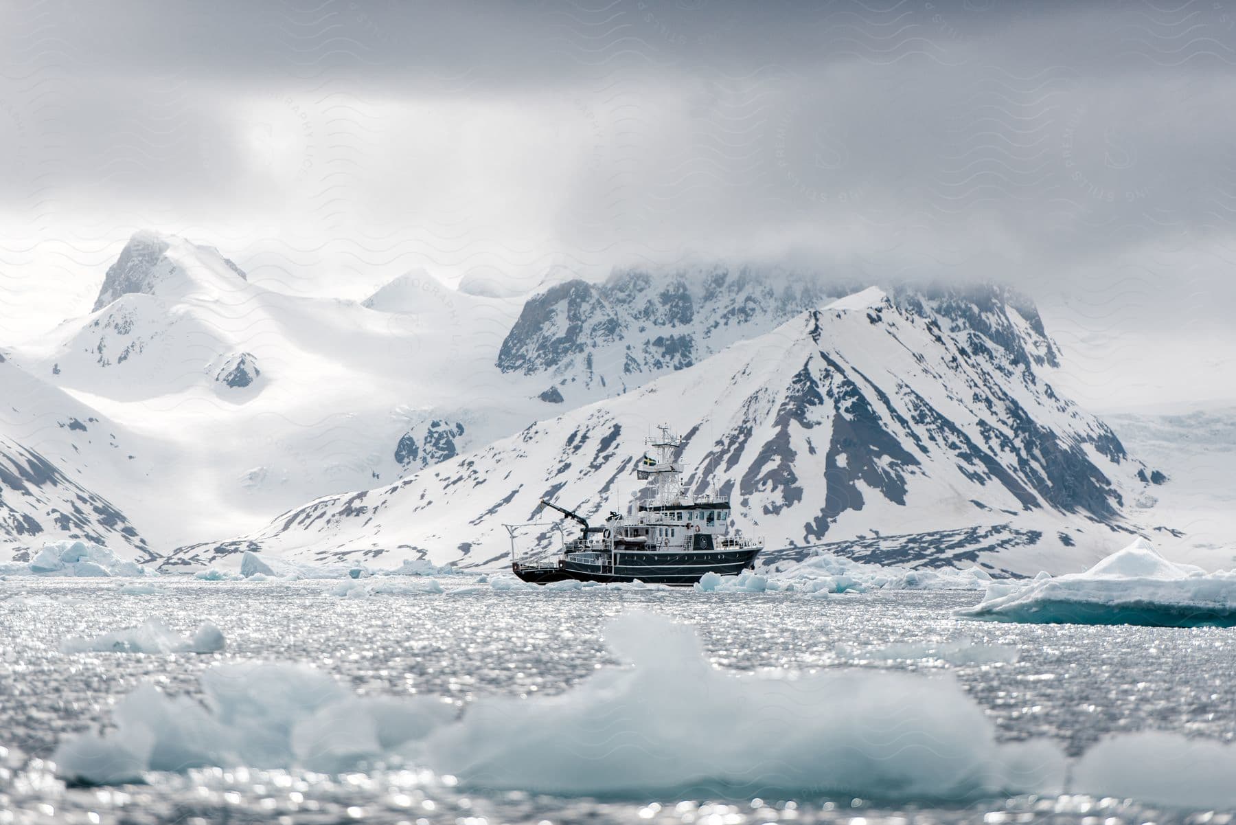 A boat sails past ice in the arctic