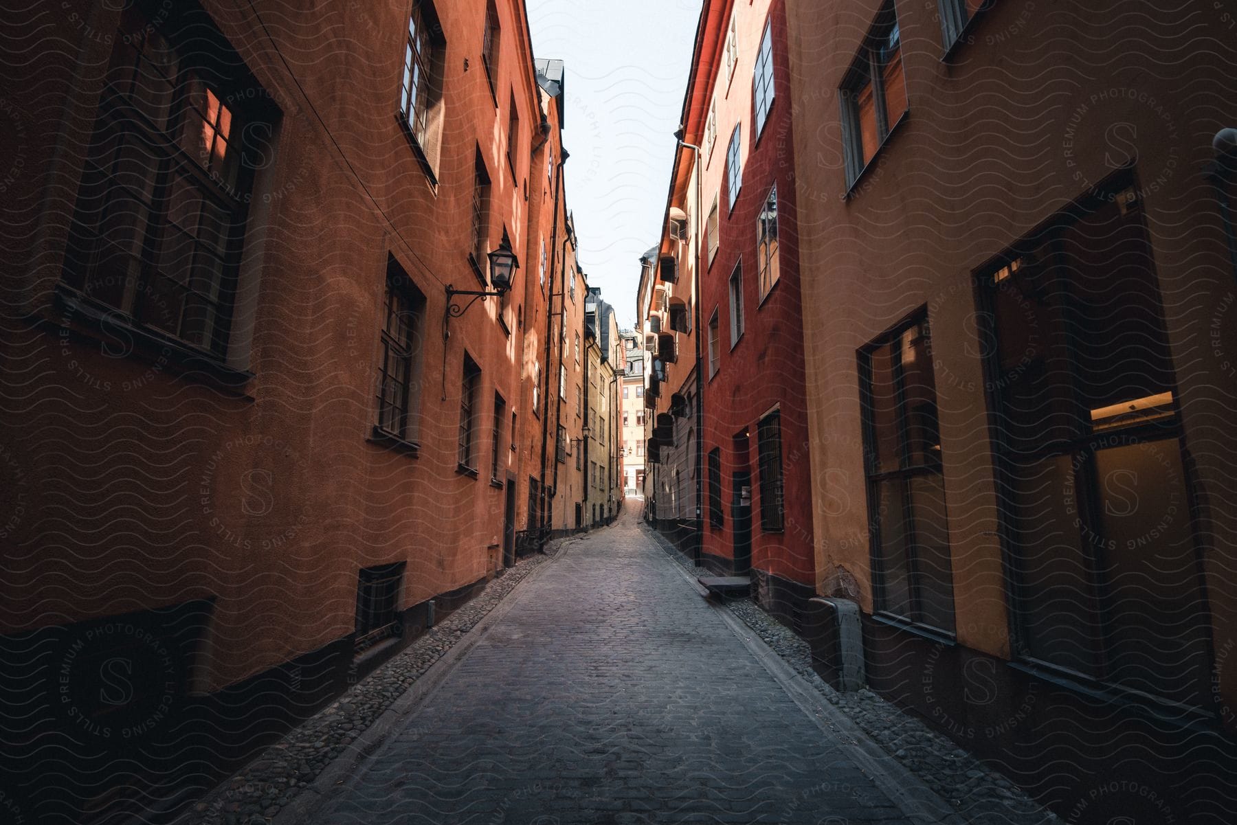 An urban city street in sweden with buildings and wooden windows