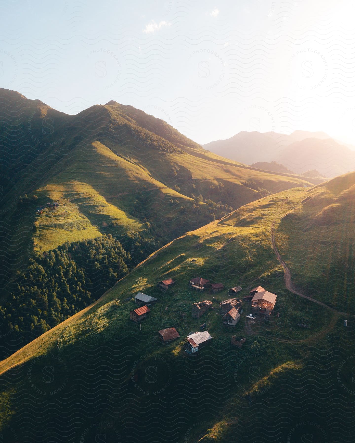 A serene countryside with a mountain and village