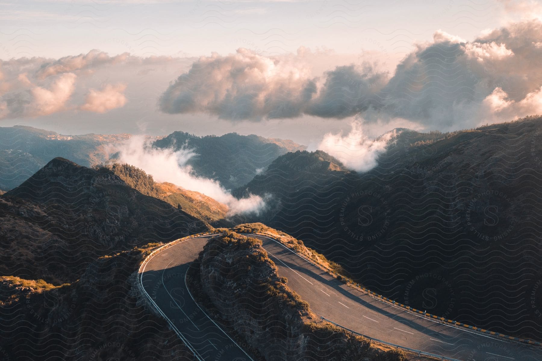Empty mountain road above the clouds in madeira island portugal at sunrise