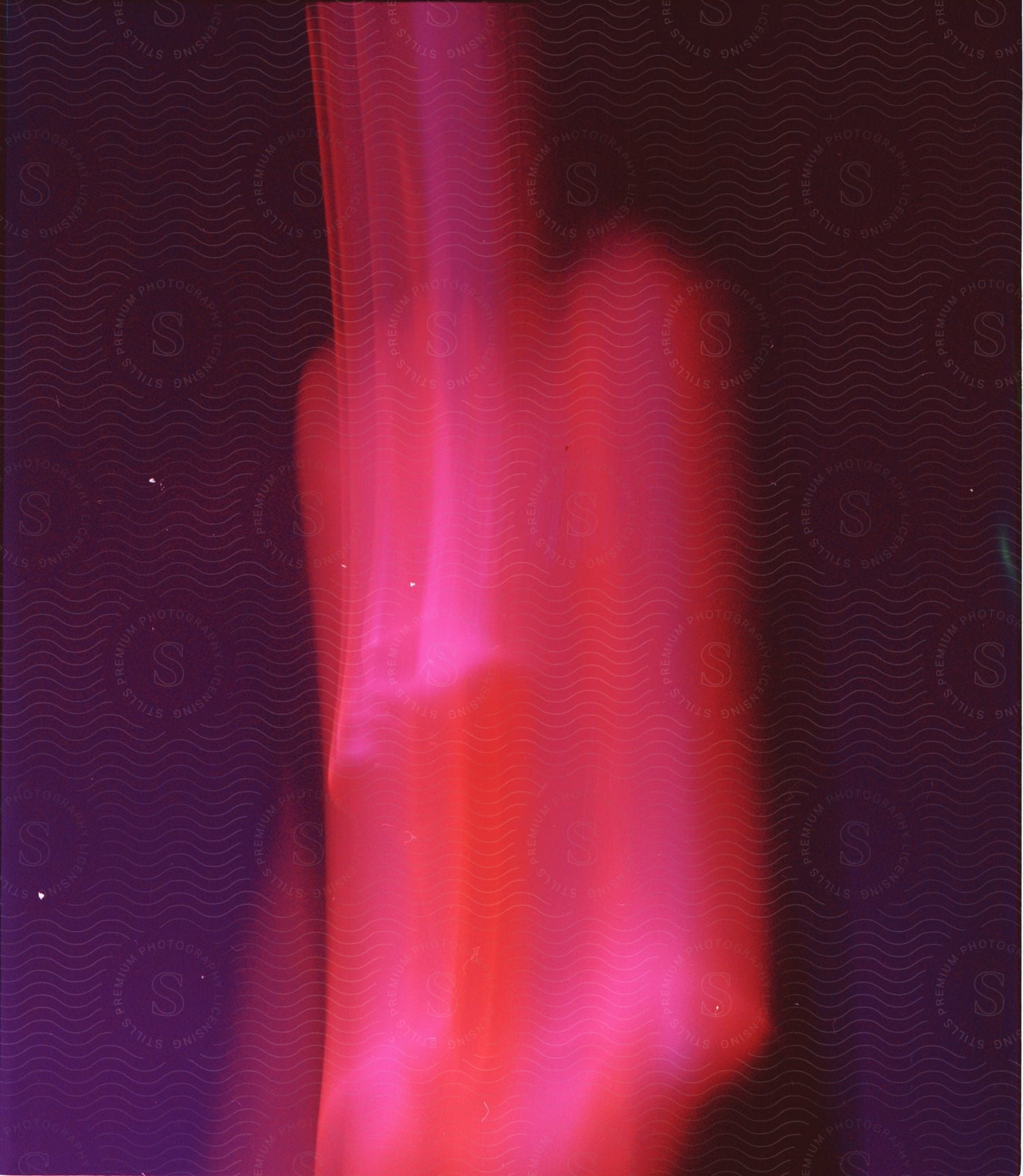 Abstract image of a person distorted by blurry lights and motion blur