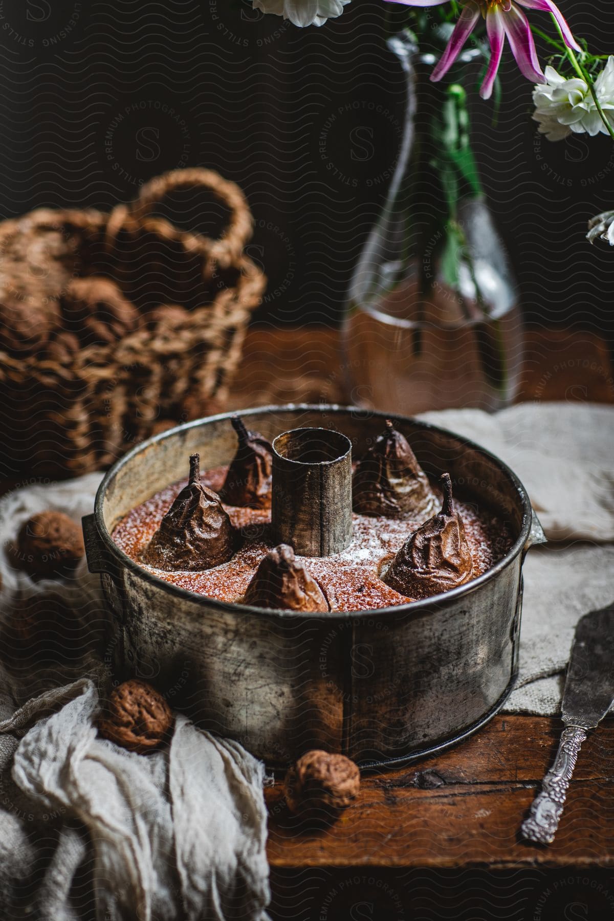 Stock photo of close up of a baked pie with pears on a vintage wooden table