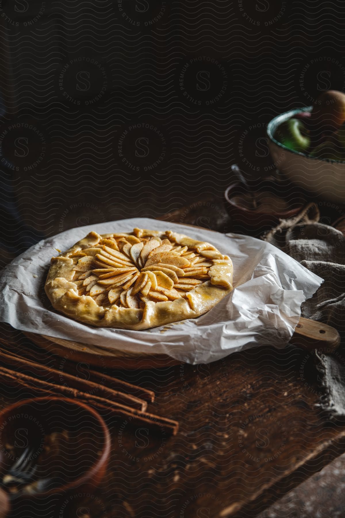 Stock photo of close up of an apple pie on a rustic wooden table