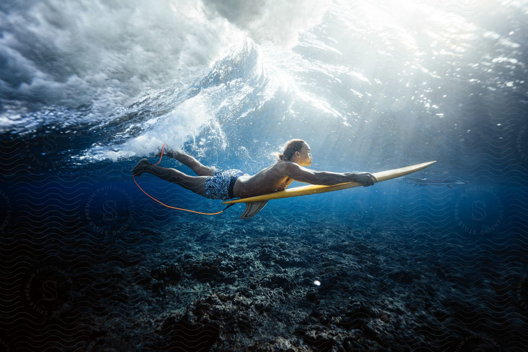 A man is surfing in the ocean during the daytime